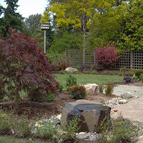 Allison Residence - Water feature and feature frames the patio.