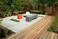 Flexible seating as well as built in ipe and steel benches provide entertaining spaces for the owners. The rear yard is lit at night to provide ambiance. Flexible seating as well as built in ipe and steel benches provide entertaining spaces for the owners. The rear yard is lit at night to provide ambiance.