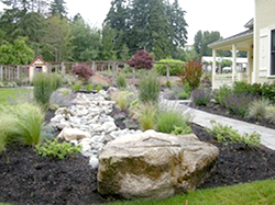 High Cascade boulders, many from the property, define the stream bed. Cutting flowers from the adjoining bed will be will be gathered by the kitchen staff to decorate the house and patios for events High Cascade boulders, many from the property, define the stream bed. Cutting flowers from the adjoining bed will be will be gathered by the kitchen staff to decorate the house and patios for events
